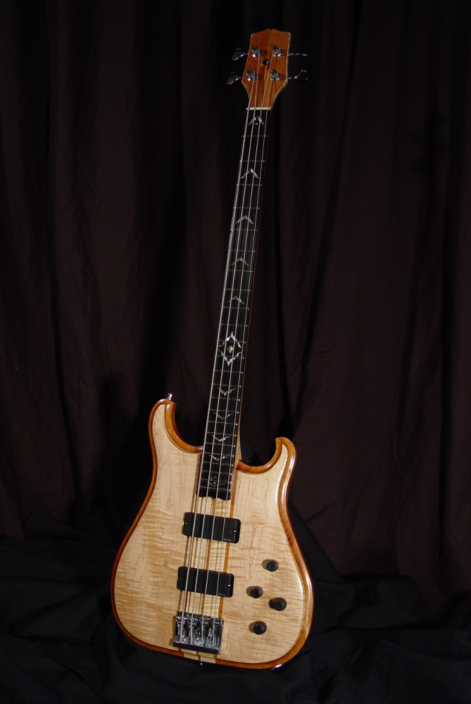 front view of michael mccarten's double cutaway electric bass model