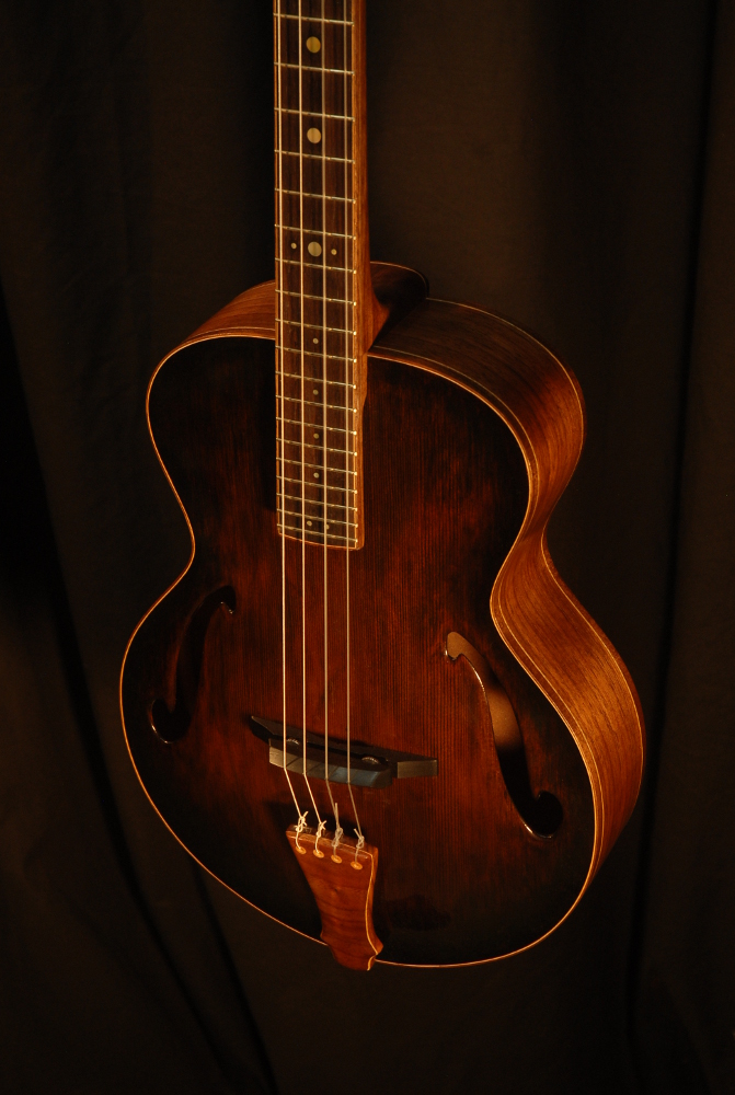 front view of the body of michael mccarten's archtop baritone ukulele model
